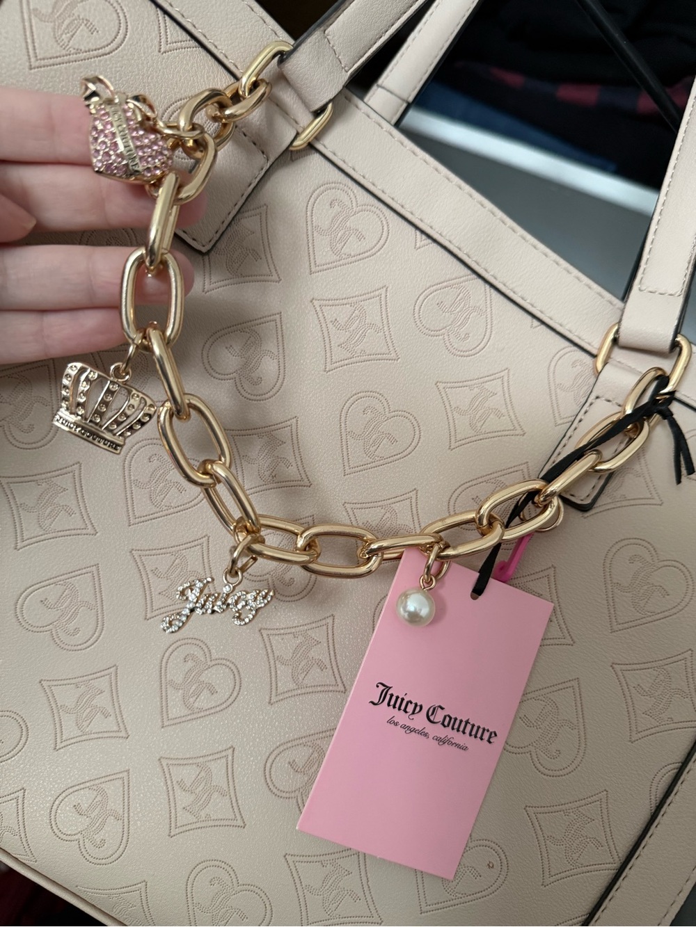 Juicy Couture Beige Tote with Gold Charm Chain and Pink Tag